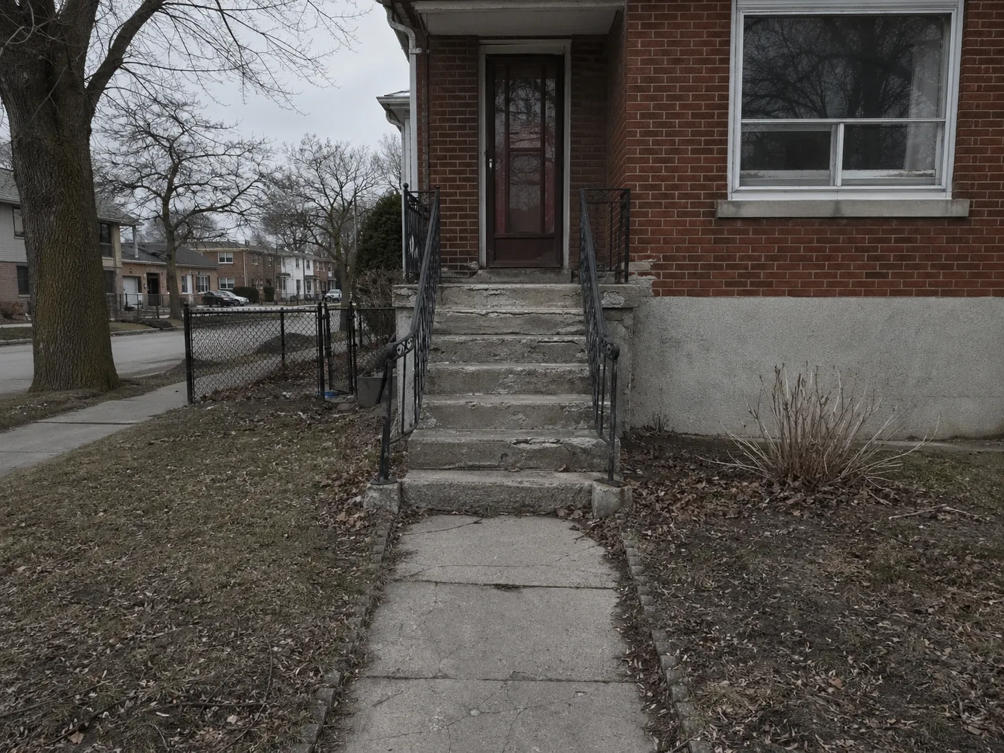 East York front entrance before renovation — worn concrete steps and walkway